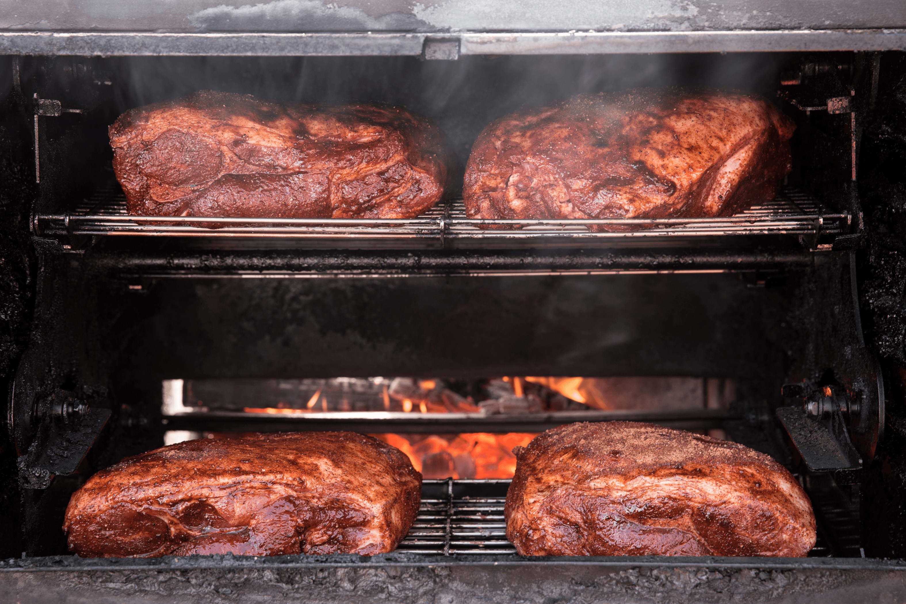 Homepage placeholder Meats smoking on a grill